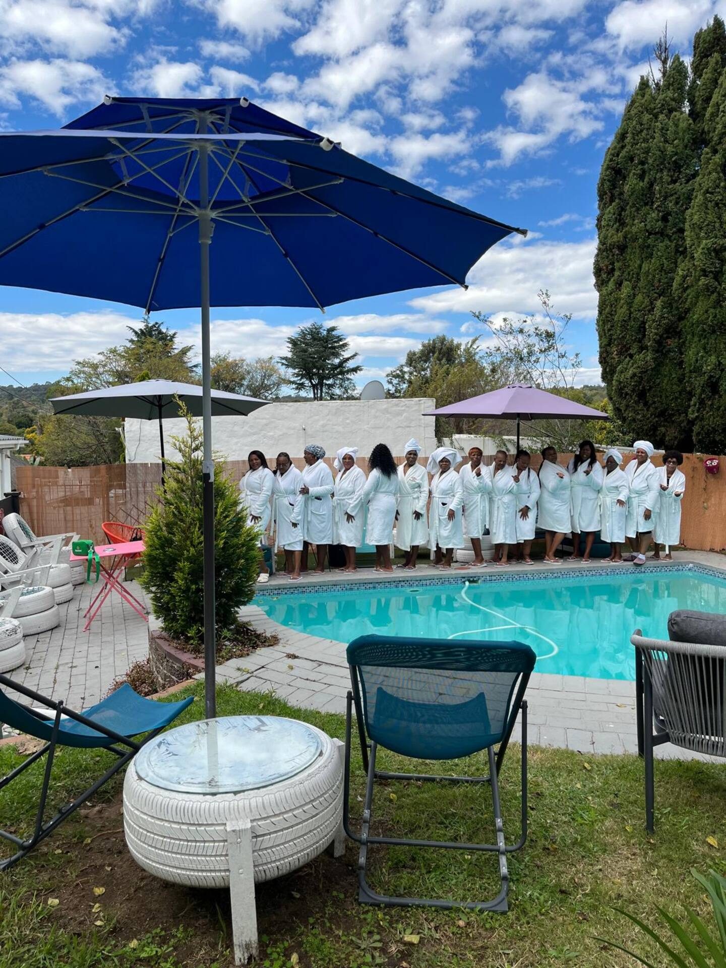 Guests gathered poolside at Muco Guesthouse